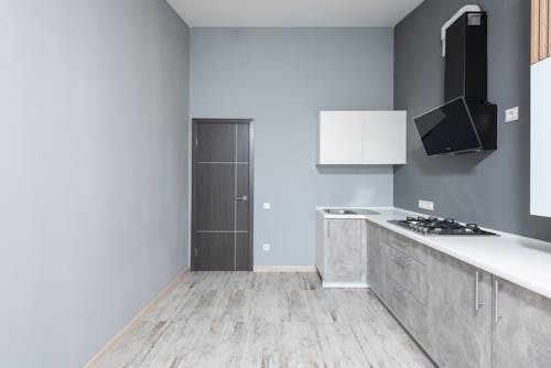 Free Spacious minimalist kitchen with modern appliances and marble countertops. Stock Photo