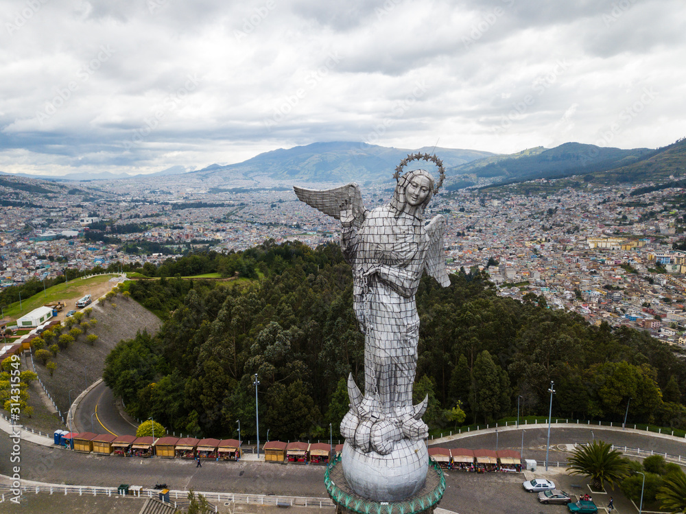 Beautiful view of Virgen del Panecillo statue on top of a hill in ...