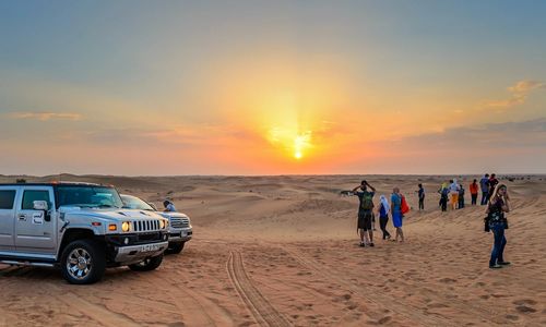 Morning Desert Safari with Sunrise, Dune Bashing, Camel Ride & Sandboarding