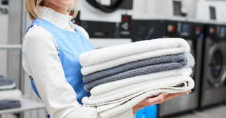 What is the average lifespan of hotel linens before they affect temperature management?